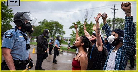 MINNEAPOLIS: People face off with police near the Minneapolis 3rd Police Precinct.